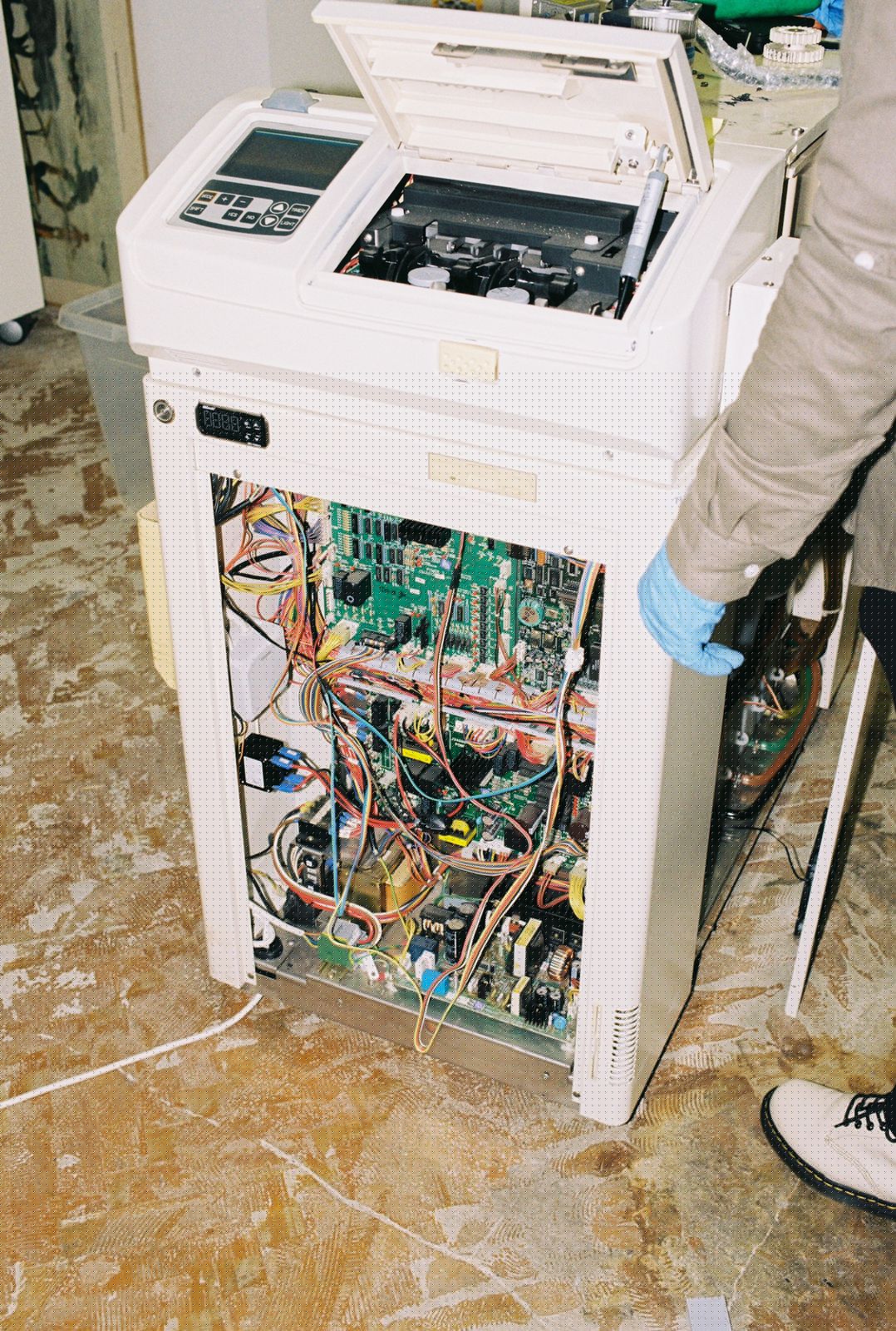 A processor mid-conversion, control board and wiring exposed during the rebuild